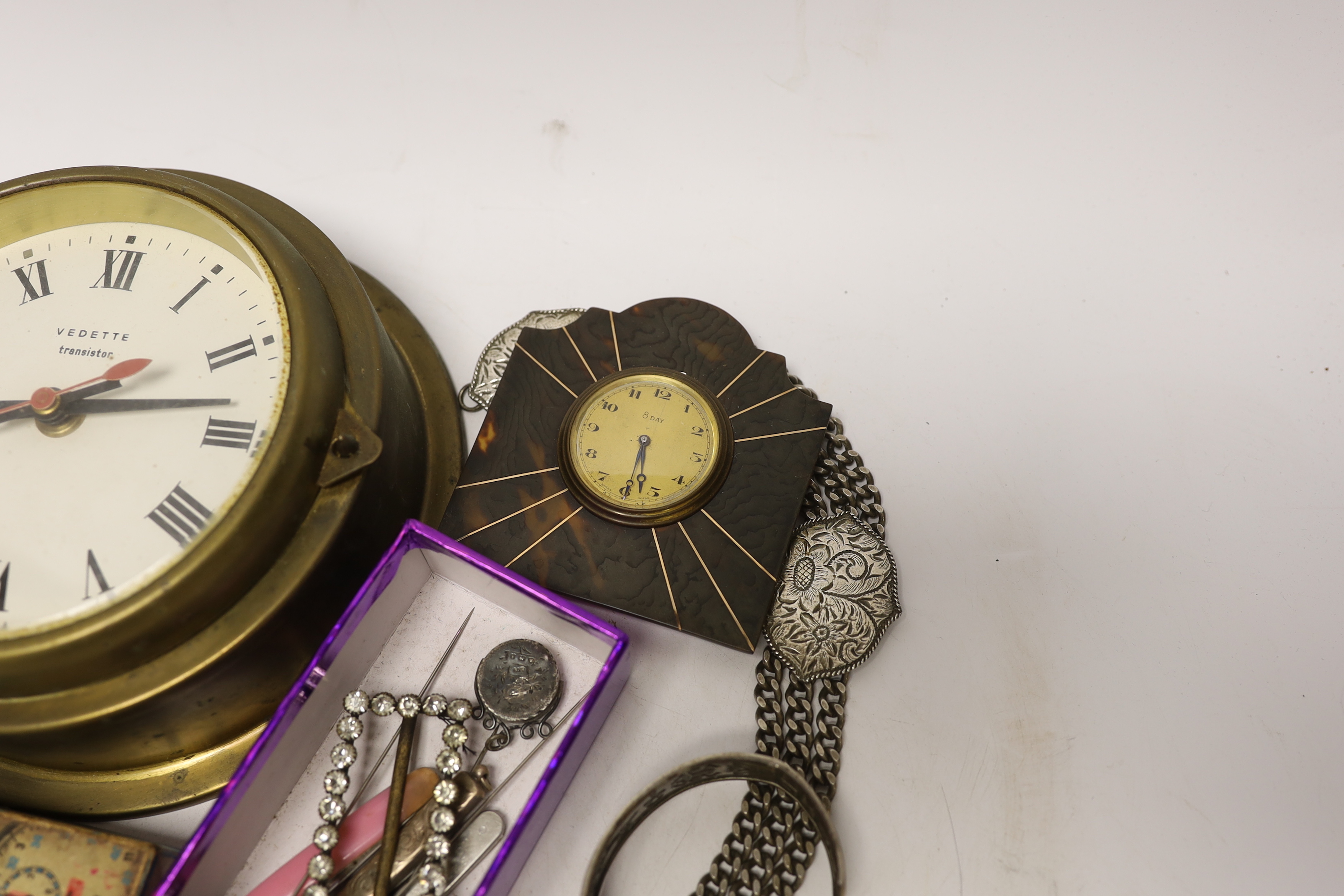 A quantity of mixed collectibles to include an eight day tortoiseshell and metal mounted travel clock, etc.